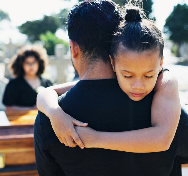 father and daughter hugging