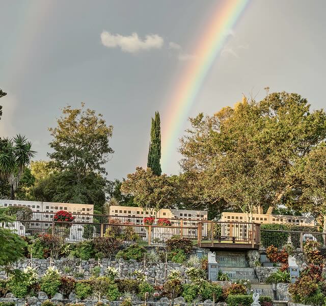memorial park with rainbow in the sky