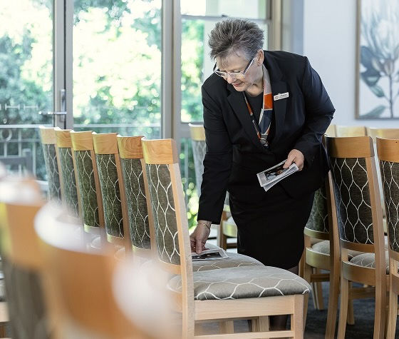Somerville funeral director arranging the chapel for a service