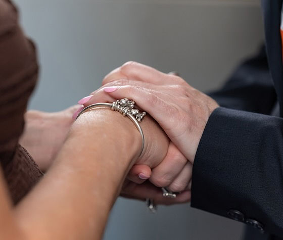 two people holding hands