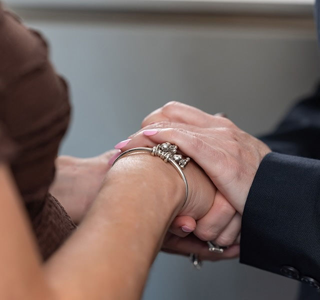 two people holding hands